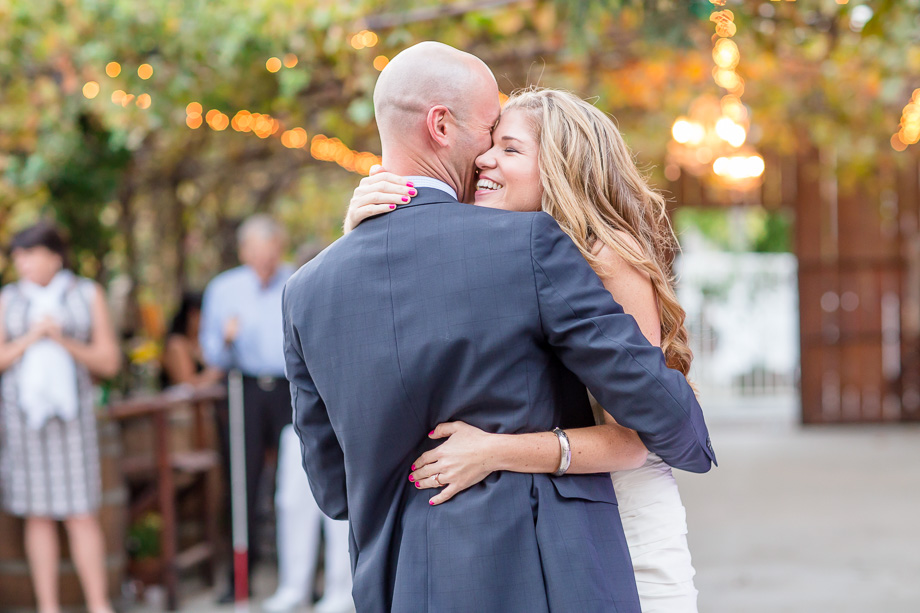 romantic outdoor first dance wedding photo at Coyote Ranch in San Jose with string lights