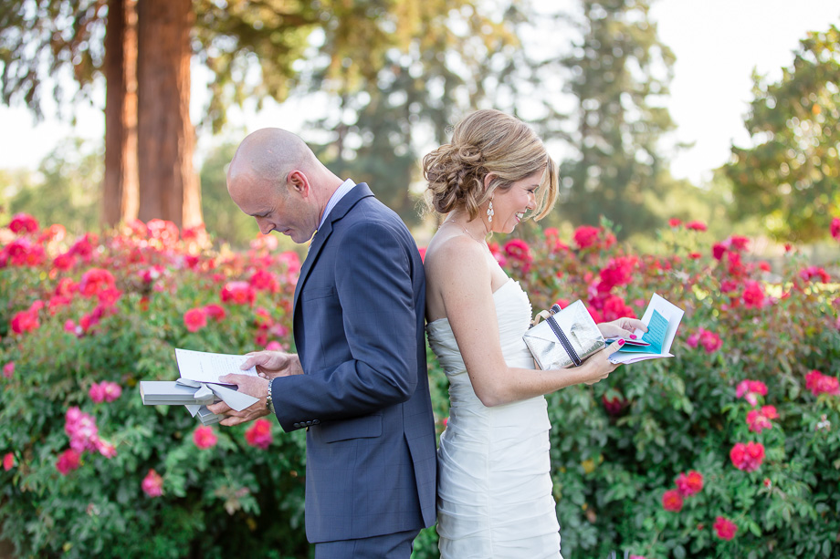 exchanging love letters before ceremony - municipal rose garden wedding