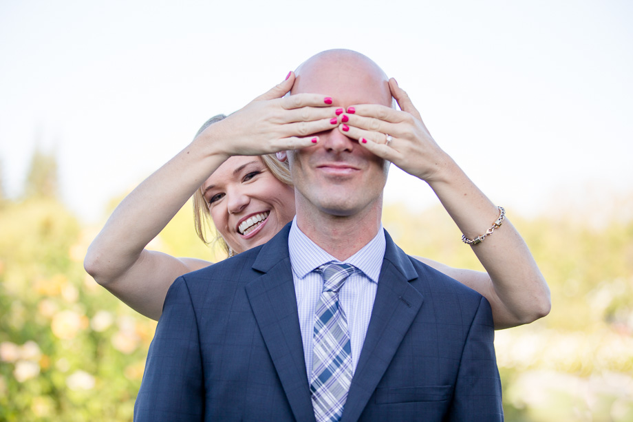 bride covering up groom's eyes before first look