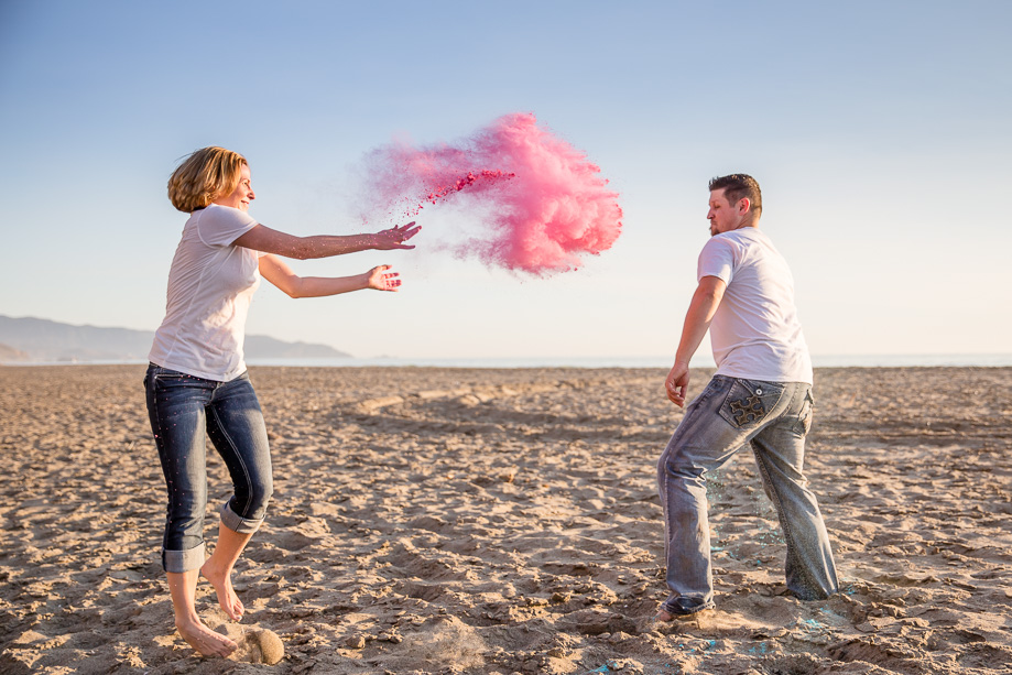 fun and colorful powder paint fight engagement photo on california beach - san francisco lifestyle photographer