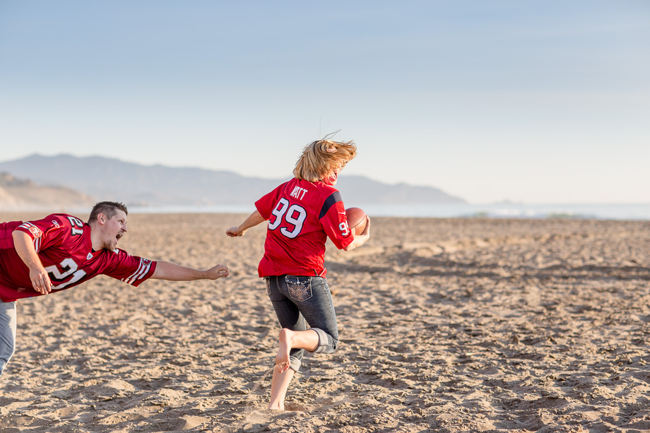 fun and energetic football beach engagement photo