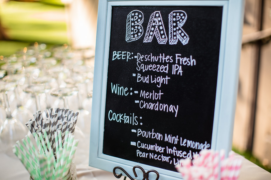 wedding alcohol bar sign with pastel color paper straws