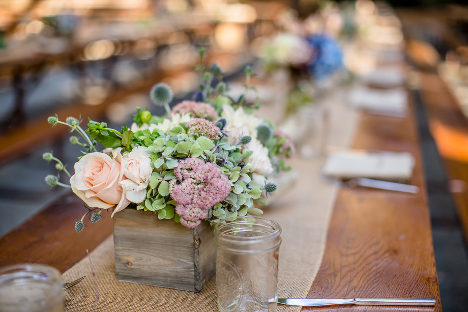 gorgeous wooden flower box centerpiece on long farm table - saratoga spring wedding unique floral arrangement