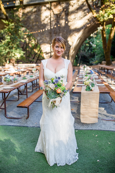 a succlents bridal bouquet that matches the rustic and romantic setting of the wedding