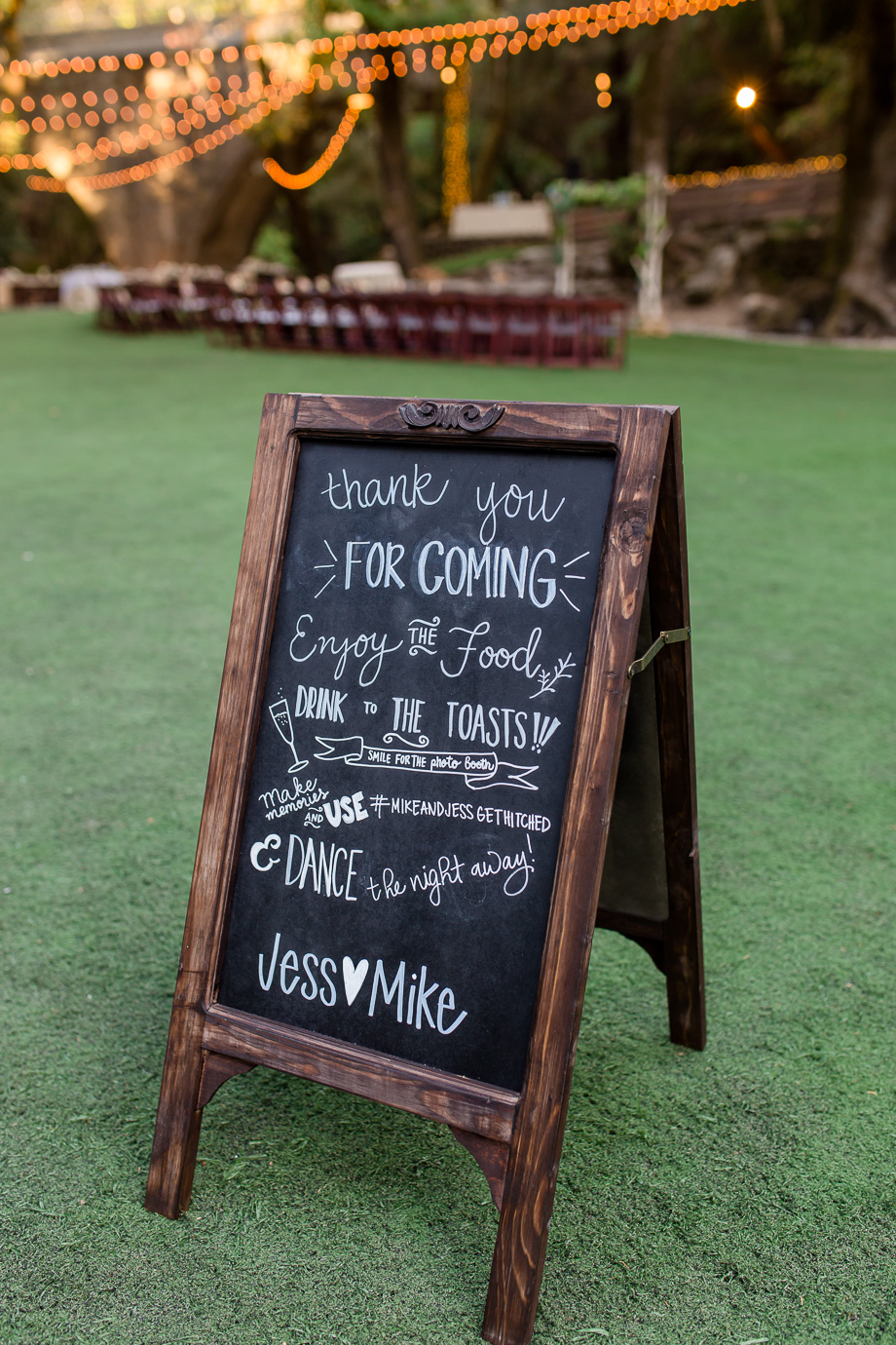 artsy wedding welcome chalkboard sign with dark wooden frame