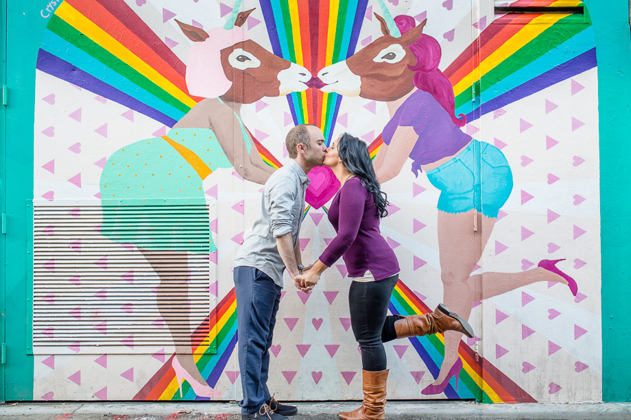 fun and colorful Clarion Alley graffiti wall engagement photo San Francisco demoncracy mural