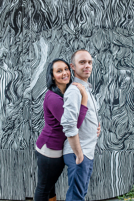 engagement photo in front of cool graffiti