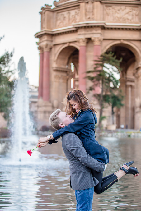 engagement photo in front of Palace of Fine Arts fountain