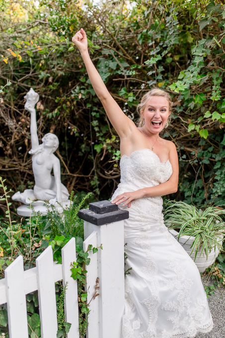 bride making a funny statue pose