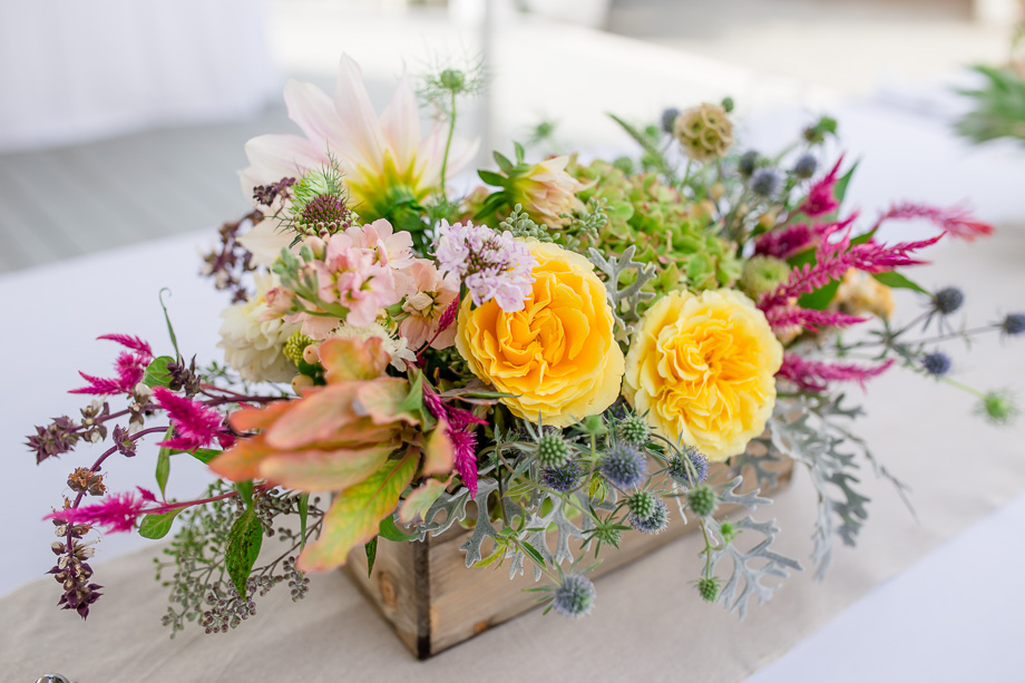vibrant floral centerpiece in a wooden box - bay area rustic garden wedding