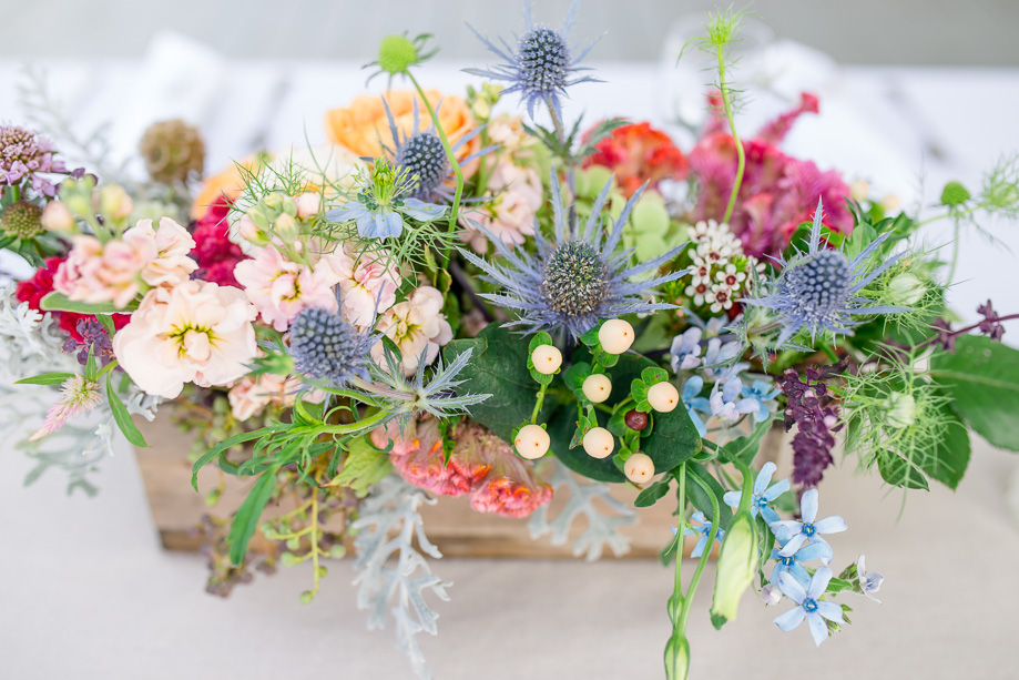 vibrant floral centerpiece in a wooden box