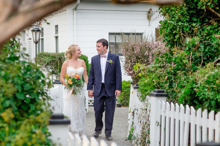 bride and groom walking at Monarch Cove Inn