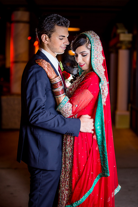nighttime wedding portrait in traditional Pakistani dress