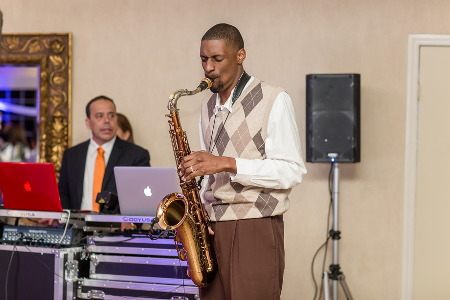 surprise saxophone performance during wedding reception