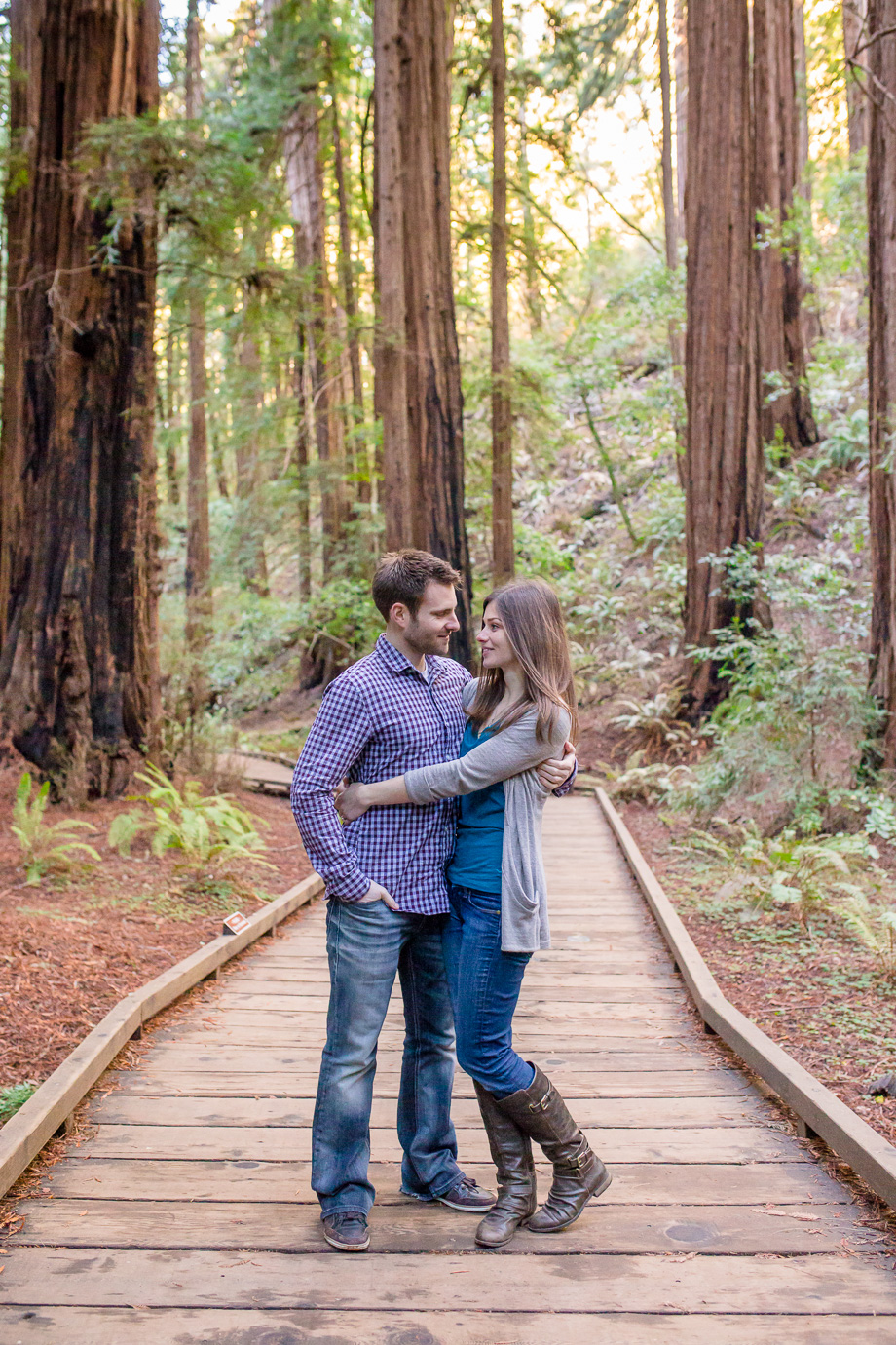 muir woods national park engagement photo on the hiking trail