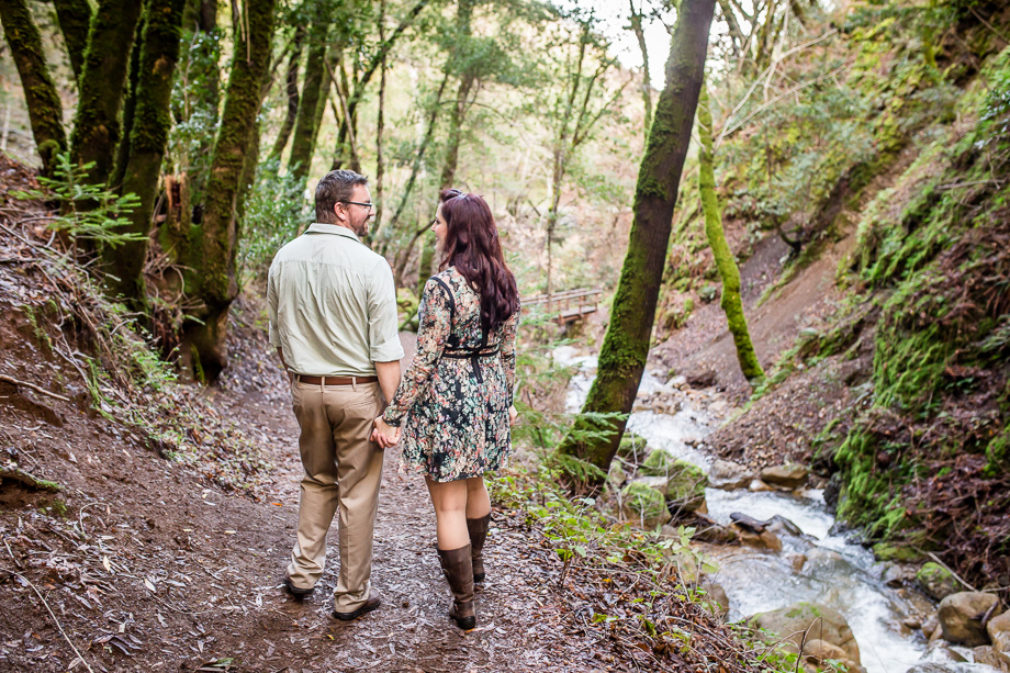 engagement photograph on hiking trail next to creek