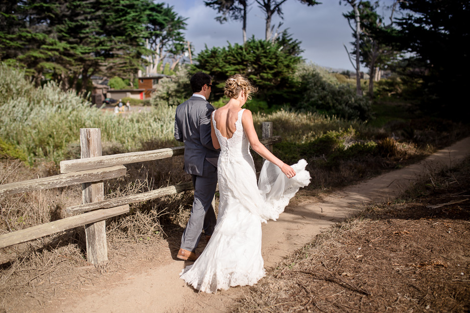 bride and groom walking along path