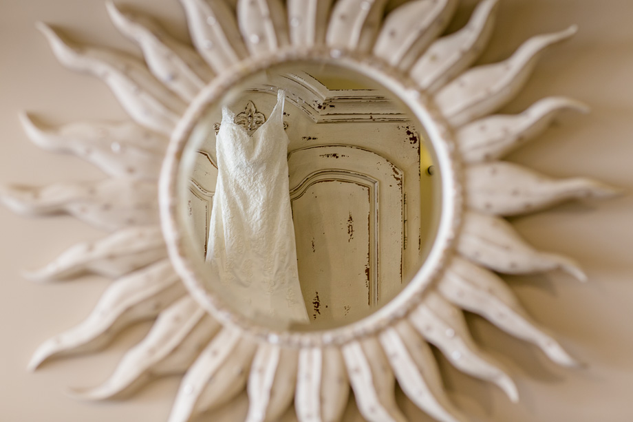 creative photo of wedding dress in a flower mirror