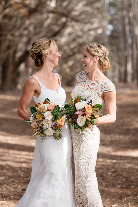 cute photo of bride and maid of honor with their bouquets - San Francisco wedding photographer