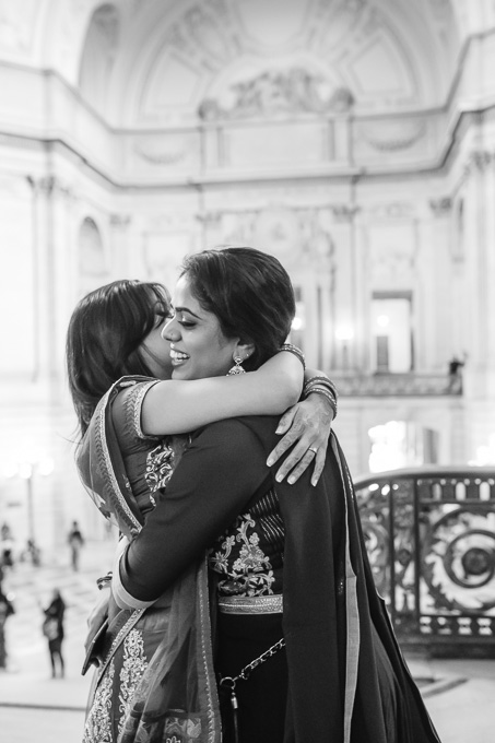 bride and sister hugging after wedding at San Francisco City Hall