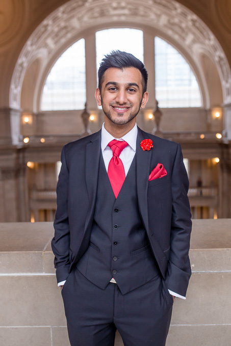 Handsome groom portrait at the city hall