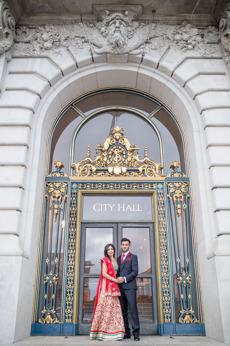 beautiful couple in front of San Francisco City Hall front door