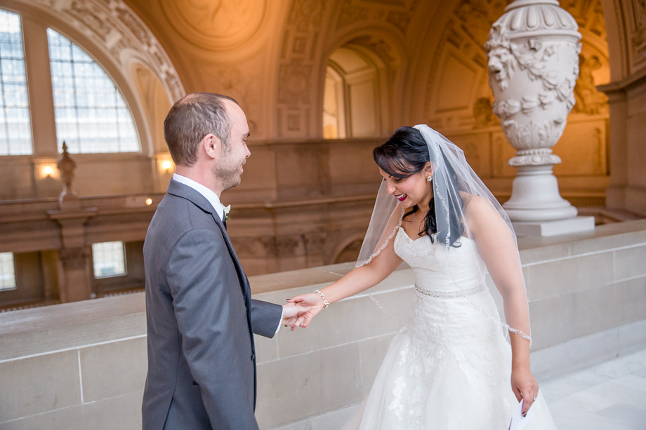 bride and groom sees each other before their wedding ceremony and reception at SF city hall building