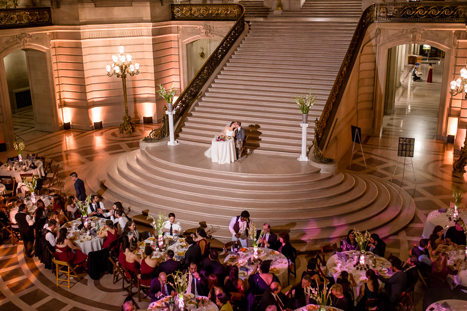 San Francisco City Hall wedding reception kissing under the rotunda