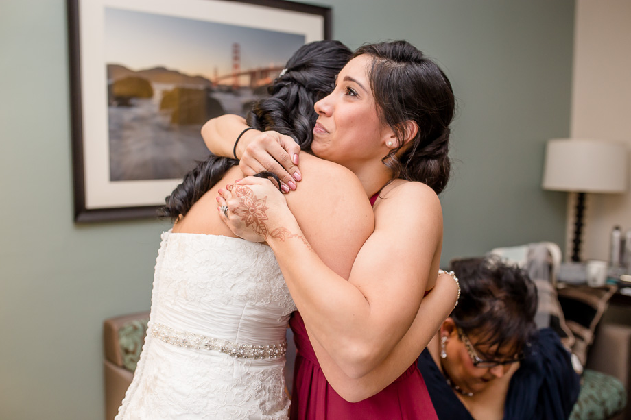 bride hugging her bridesmaid