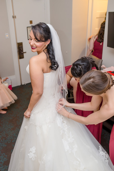 bride getting into her dress at WorldMark San Francisco