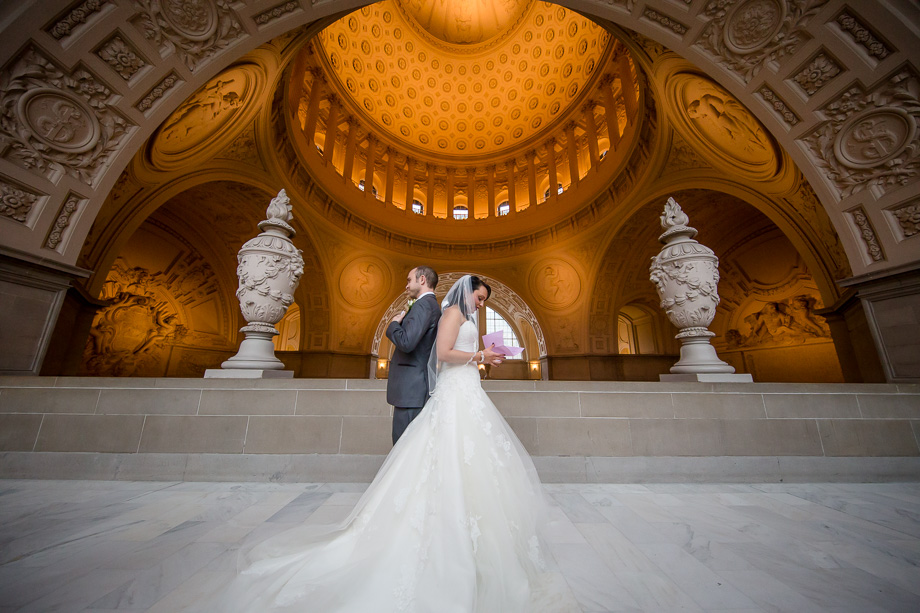 love letter exchange at SF city hall before their wedding ceremony and reception at night