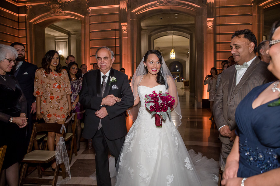 bride escorted by father at the City Hall