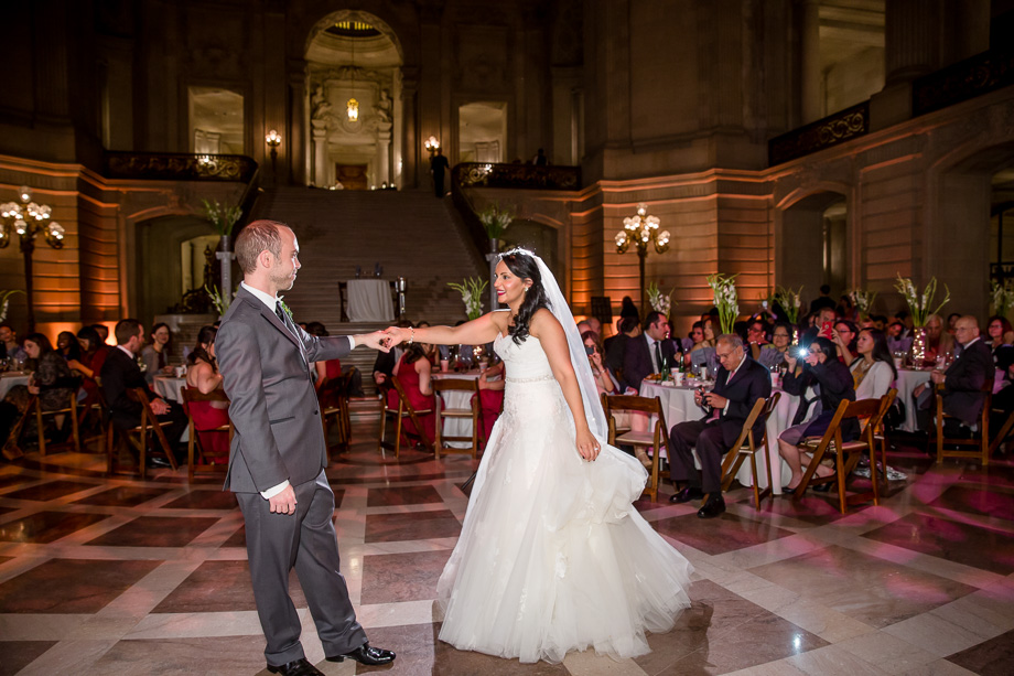 bride and groom dance for the first time as husband and wife at their San Francisco city hall wedding