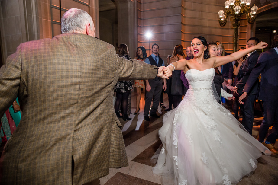 bride dancing with a guest at San Francisco City Hall dance floor