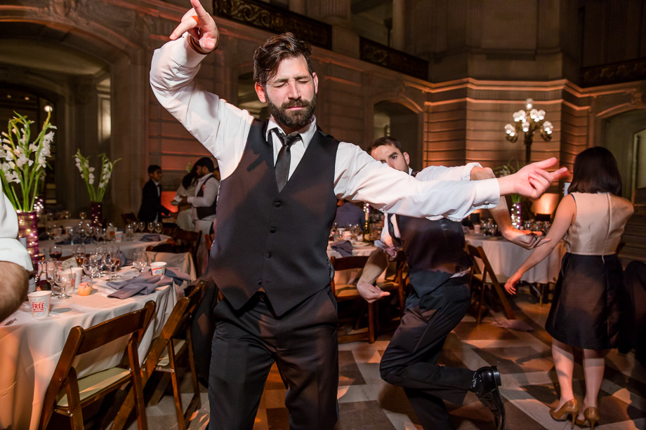 wedding guest dancing at SF city hall reception