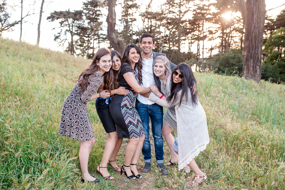 newly engaged couple with their friends at the Presidio