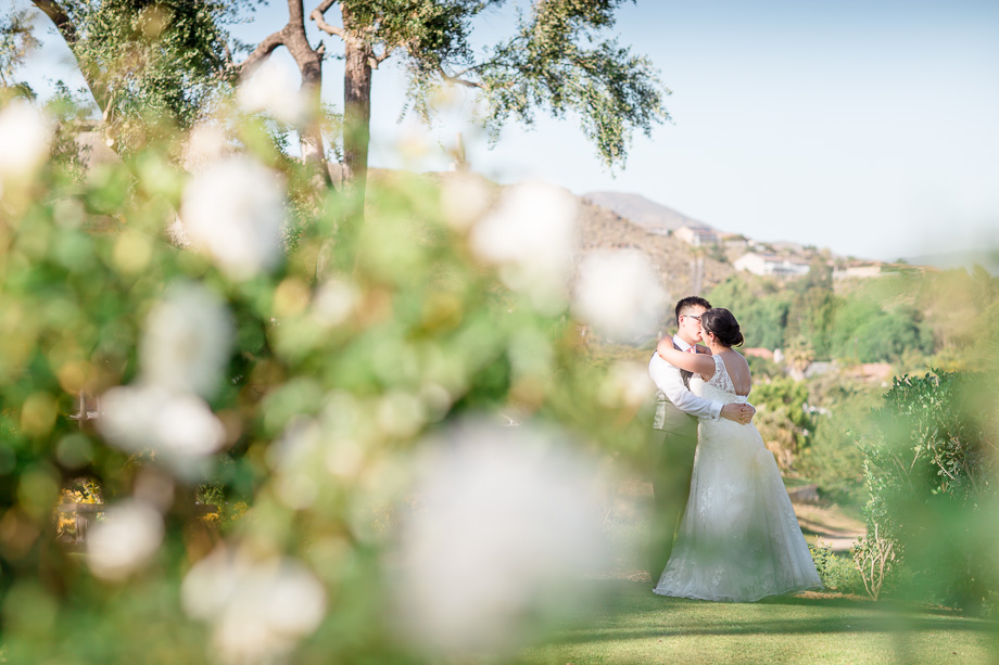 bride and groom portrait with clear skies and moutains in the background - san francisco wedding photographer