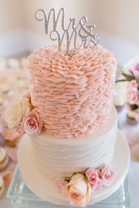 pink and cream ruffle wedding cake with fresh flowers and Mr and Mrs cake topper - california real wedding