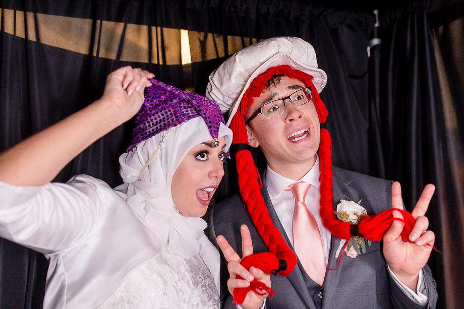 bride and groom in photo booth