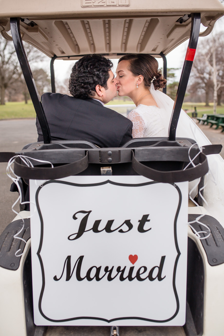 Just Married sign hanging at the back of a golf cart - Syker Beach Golf Club wedding