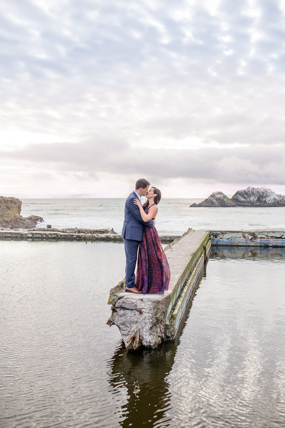 ultra romantic engagement photo at Sutro Baths with reflection