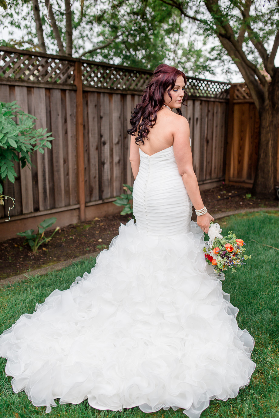 stunning bride with a beautiful ruffled wedding dress - California rainbow themed wedding