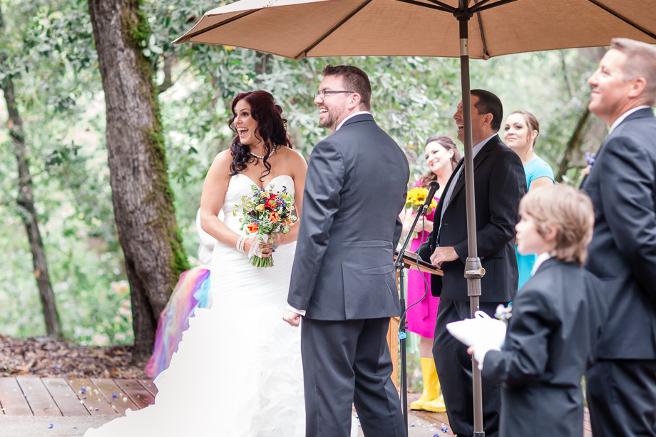a happy moment during the wedding ceremony in the woods