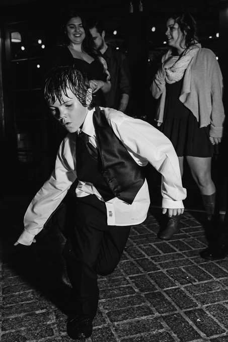 little boy tearing up the dance floor at wedding