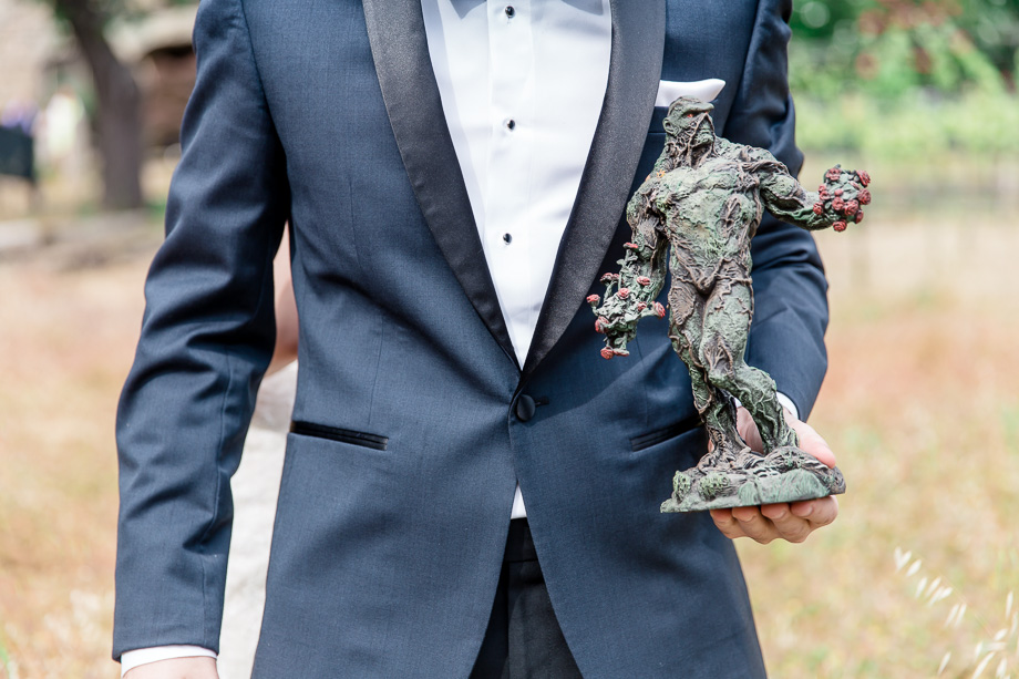 bride gave groom a big figure of Swamp Thing as the wedding gift