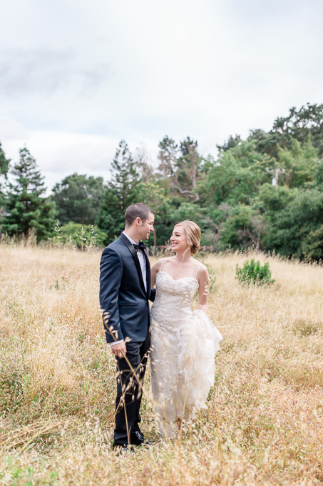 bride and groom portrait in yellow grassy field