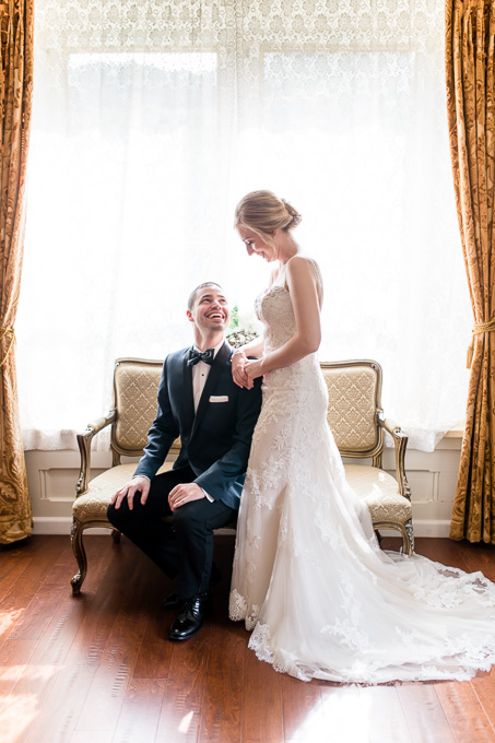 elegant bride and groom portrait on a love seat