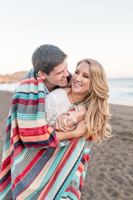 san francisco sunset beach engagement photo with colorful blanket