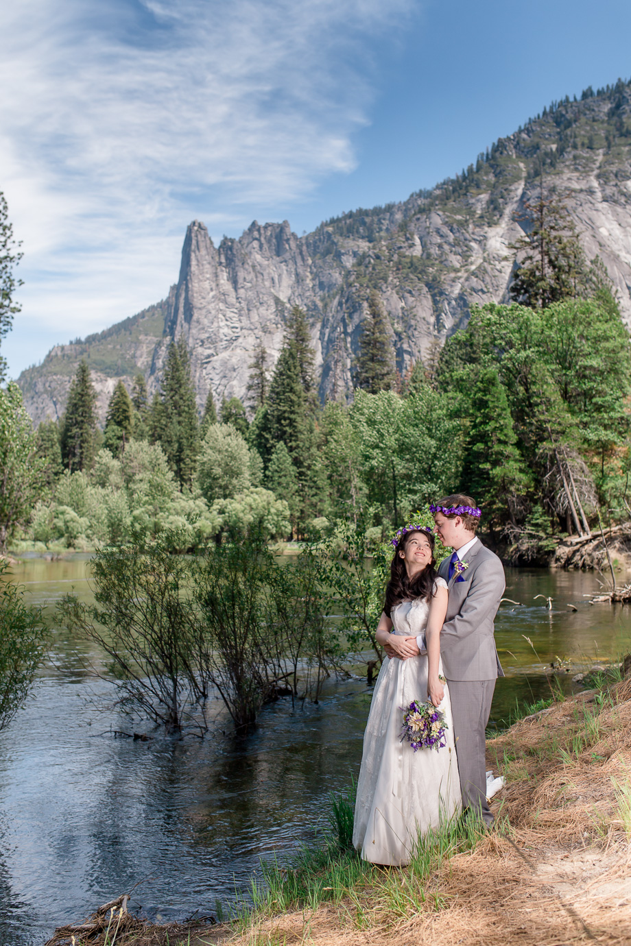 wedding at Merced River in Yosemite looking up at Cathedral Point