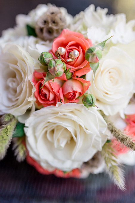 dainty earrings on the bridal bouquet